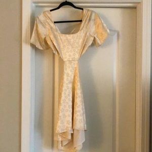 Champagne colored satin cutout dress. Worn one time for a party.